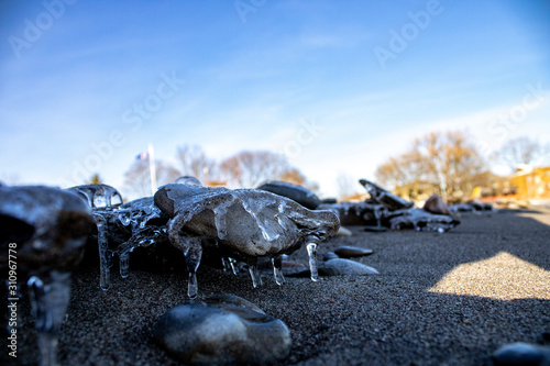 Photography Frozen shapes of rock and sand in the beach in the winter
