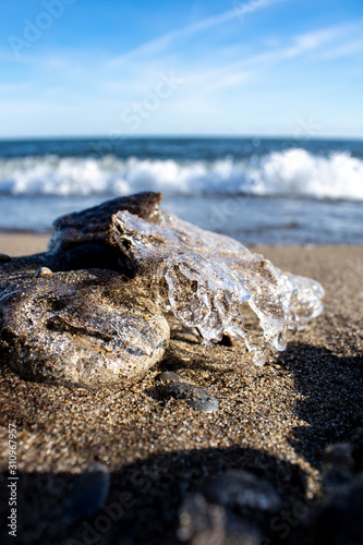 Photography Frozen shapes of rock and sand in the beach in the winter