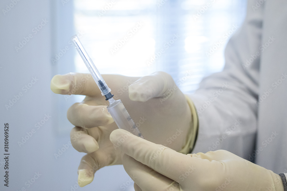 doctor with syringe in hand doctor with syringe in hand