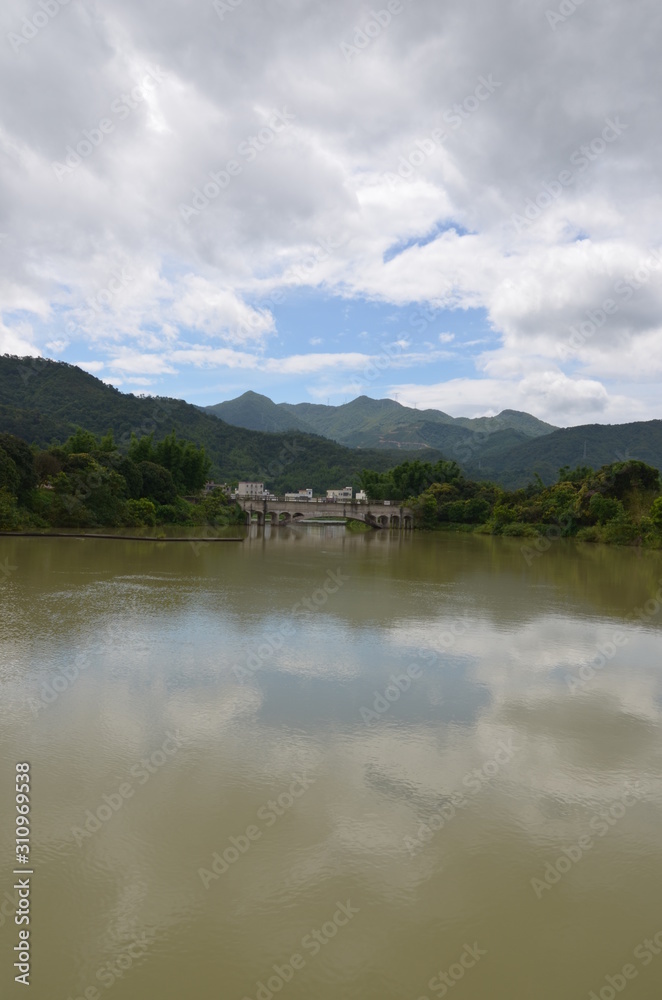 a lake in the mountains in guangdong province china, vertical form