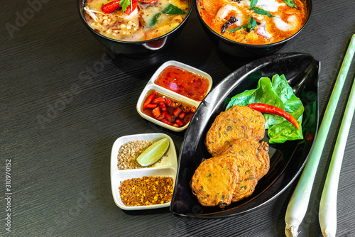 Принти на полотні Spicy fried fish cake (Tod Mun Pla), a traditional Thailand appetizer is made with fresh fish paste, long beans, red curry paste and kaffir lime leaves