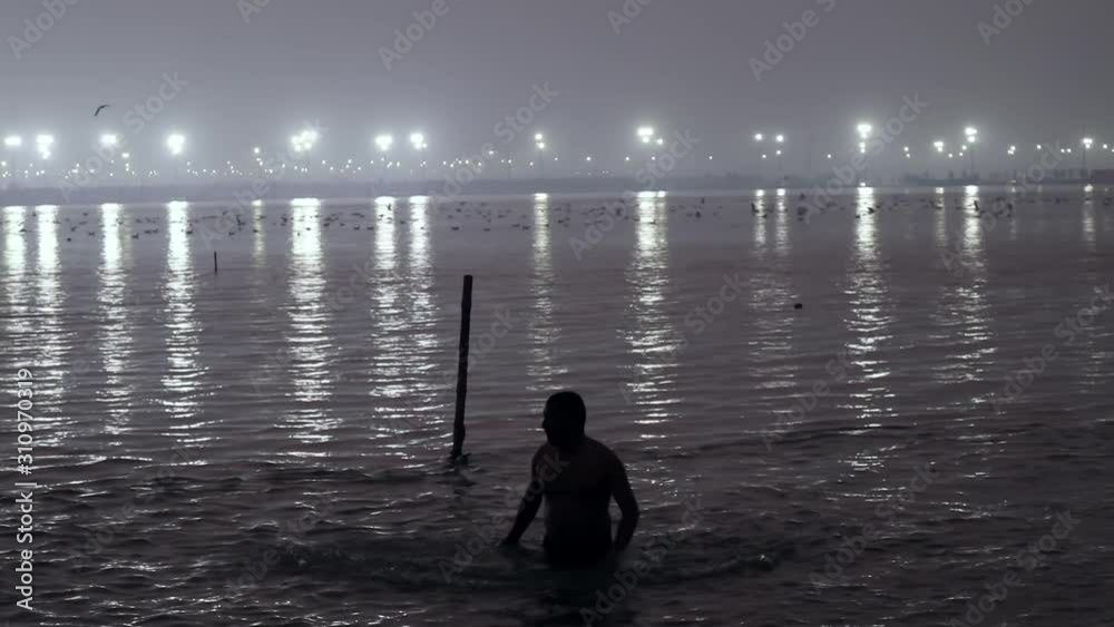 Dramatic shot of Hindu man at the Kumbh Mela 2019, Prayagraj, Uttar Pradesh, India Dramatic shot of Hindu man at the Kumbh Mela 2019, Prayagraj, Uttar Pradesh, India