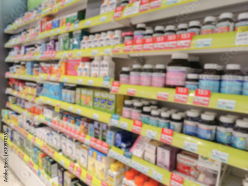 Blurred image of shelves with supplements and medicine