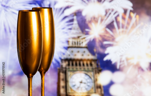 champagne glasses and fireworks new year in London