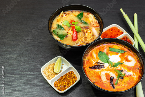 Tom Yum Soup or Tom Yam Kung is a traditional hot spicy sour soup, typical dish in Thailand, usually cooked with shrimps. Empty copy space.