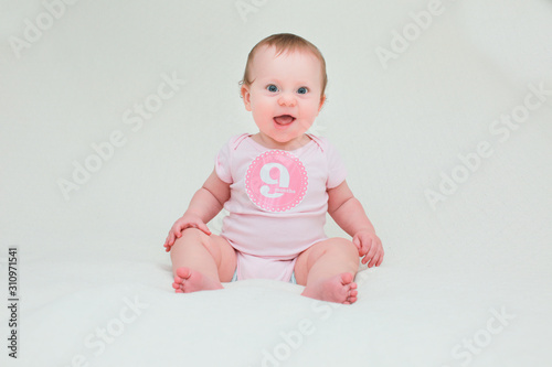 Close up Portrait of Cute Baby Girl with Sticker 9 Month Old, Happy Baby