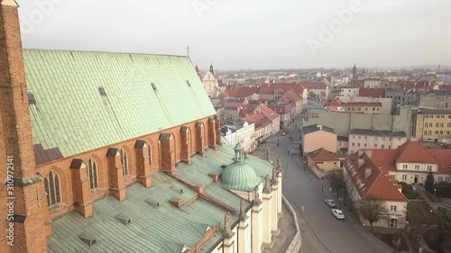 Drone footage of old Cathedral located in Poland. Name of the city is Gniezno. photo