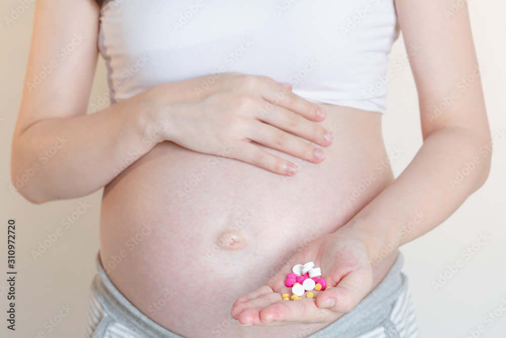 custom made wallpaper toronto digitalPregnant women with a pill and vitamin pills in the hand, Concept of pregnant women healthy and health care.