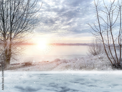 Winter background. Winter sun, ray, glare. Winter landscape with a river, snow, sunlight.