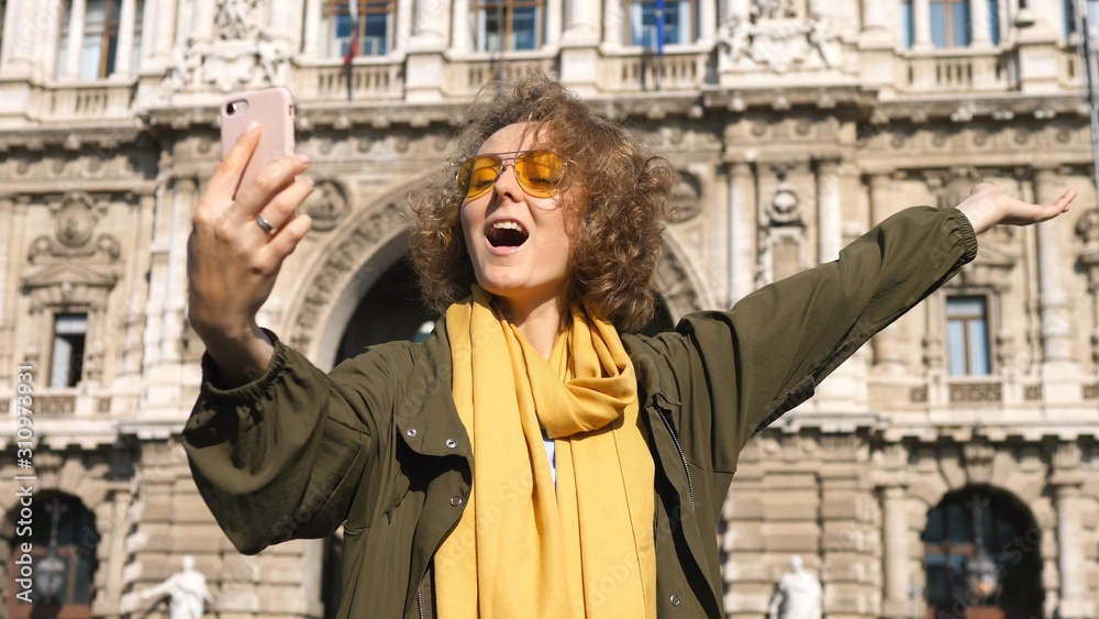 Travel Tourist Woman Smiling Taking Selfie Photo With Smartphone In City.