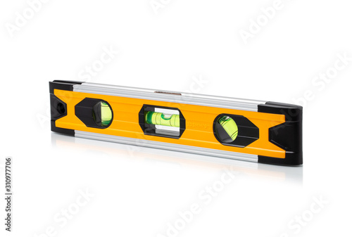 Construction bubble level yellow, yellow block level with bubble isolated on white background, clipping path included. photo