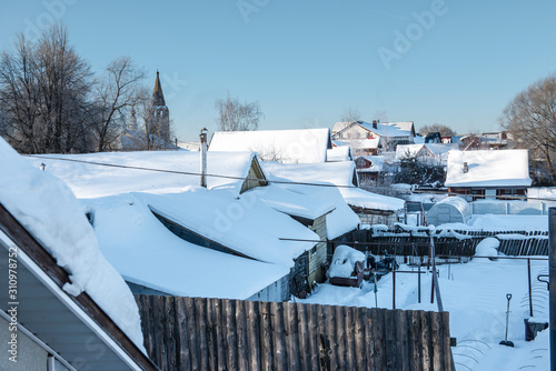 Winter landscape with a view of a typical small russian village/ Russia