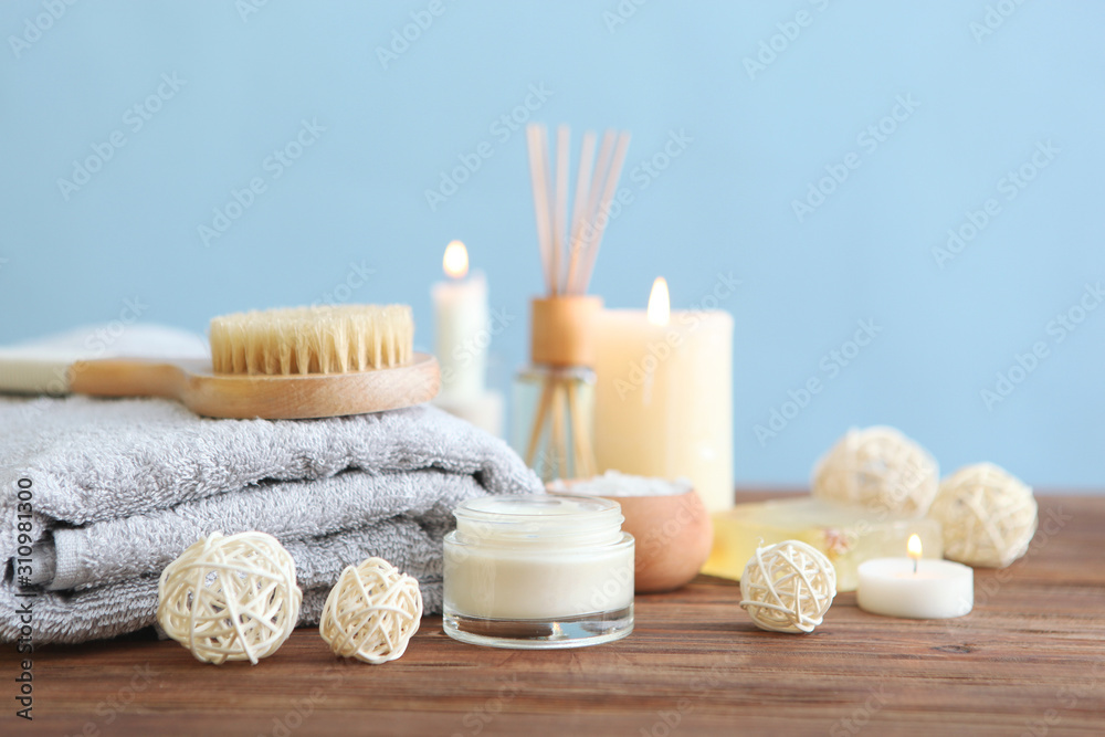 spa composition with towels and care products on the table with place for text. Body care, relaxation