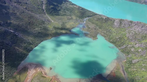 Two glacial lakes meeting in Juttenheimen, Norway photo