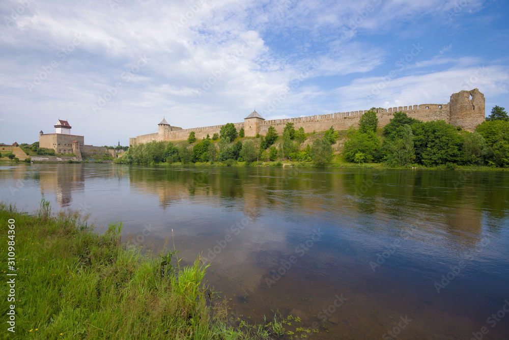 Summer landscape with Ivangorod fortress and Herman's castle. The border of Estonia and Russia