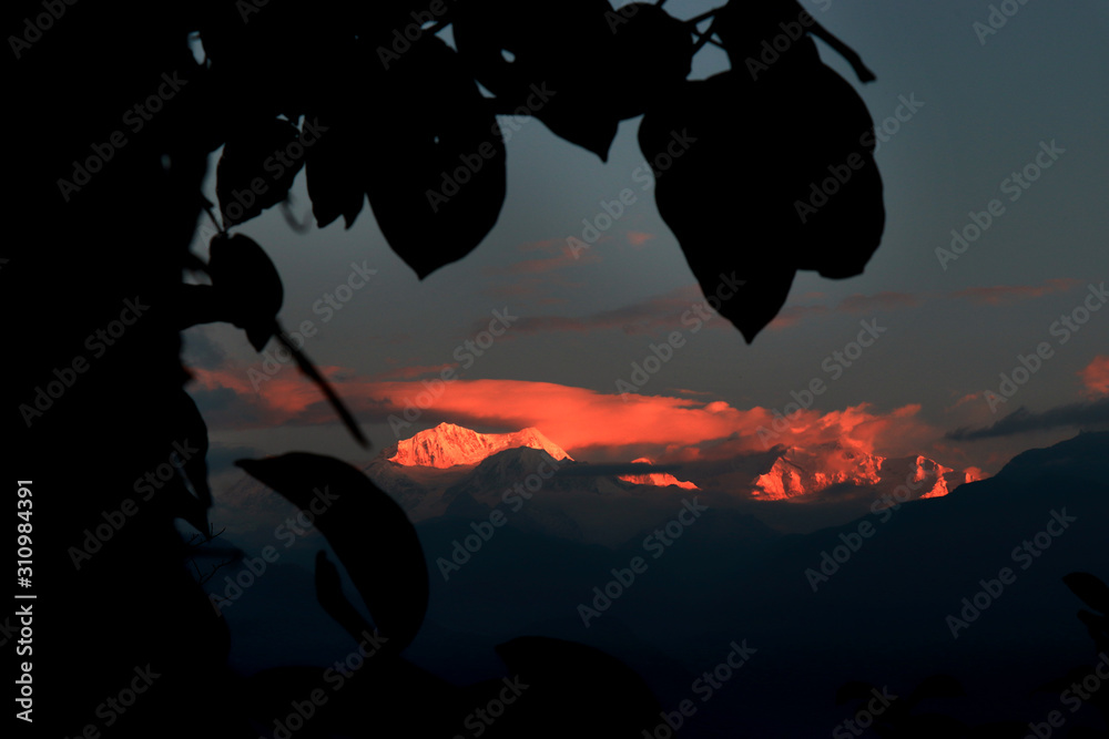 Fototapeta premium Kanchanjungha during golden hour, snow, peak, landscape, nature, Himalayan. Snowy mountains of Himalaya. A beautiful snowy mountain landscape under a blue cloudy sky..