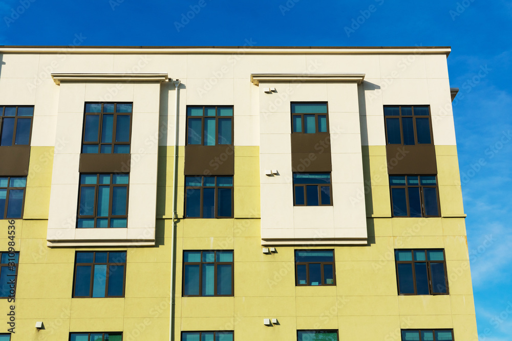 Exterior view of typical multifamily mid-rise residential building used ...