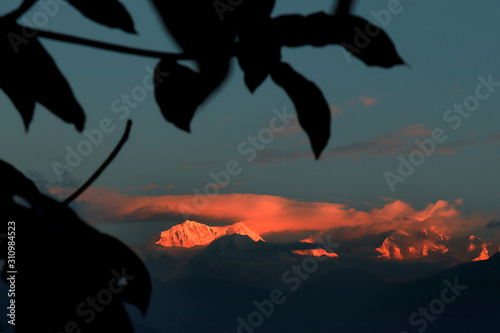 Kanchanjungha during golden hour, snow, peak, landscape, nature, Himalayan. Snowy mountains of Himalaya. A beautiful snowy mountain landscape under a blue cloudy sky.. photo