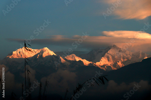 Kanchanjungha during golden hour, snow, peak, landscape, nature, Himalayan. Snowy mountains of Himalaya. A beautiful snowy mountain landscape under a blue cloudy sky.. photo