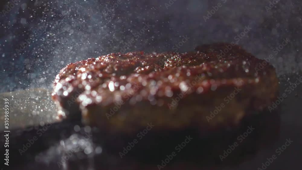Cooking beef and pork patty for burger. Meat roasted at kitchen. Slow motion.