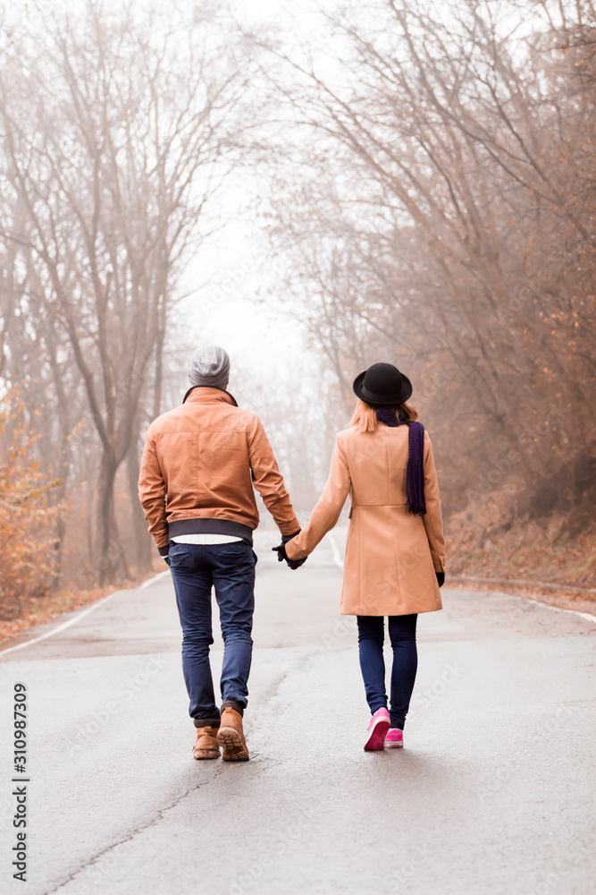 Couple enjoying outdoors in cold autumn / winter time. Couple enjoying outdoors in cold autumn / winter time.