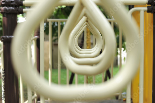 Closeup view of monkey bars playground metal construction for pulling and climbing outdoor playground