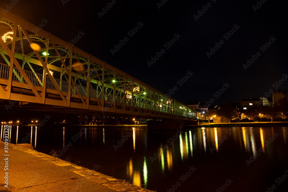 Fototapeta premium Old iron Bridge over Vltava river in Tyn nad Vltavou, Czech Republic.