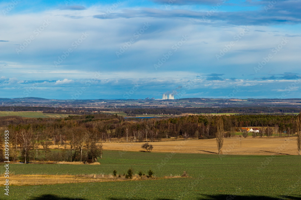 Fototapeta premium Landscape of South Bohemia with villages, forests, fields and blue sky. Czech Republic.