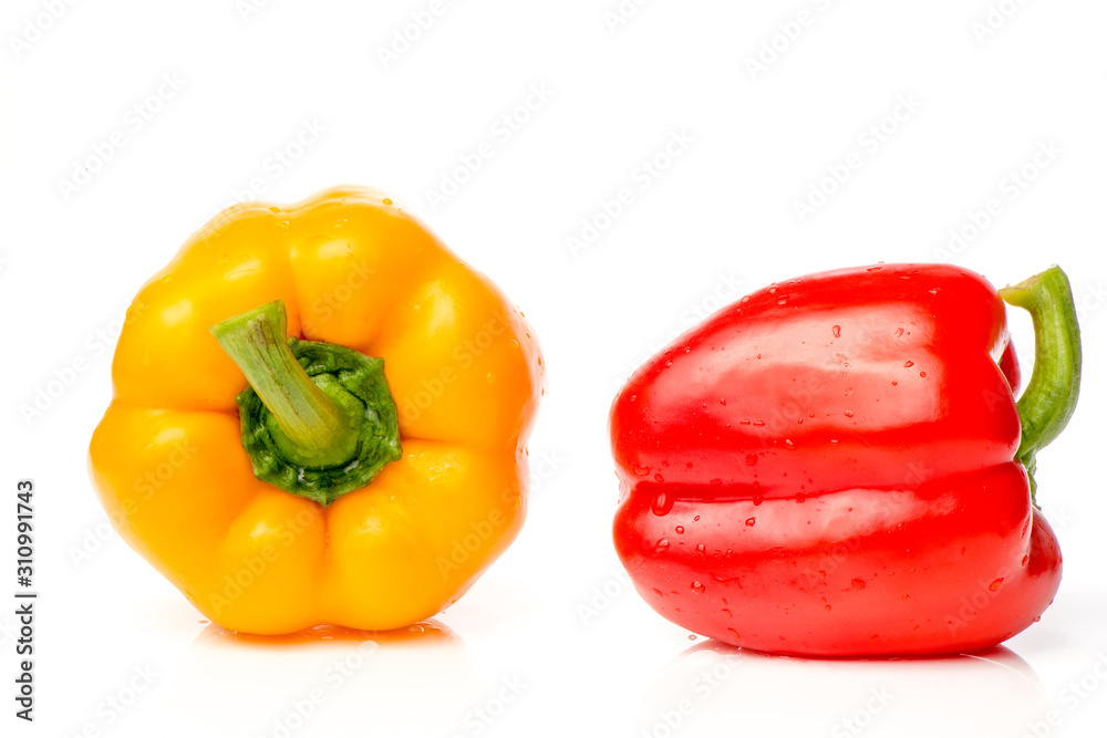 Two red and yellow Fresh pepper are isolated in white background. Two red and yellow Fresh pepper are isolated in white background.
