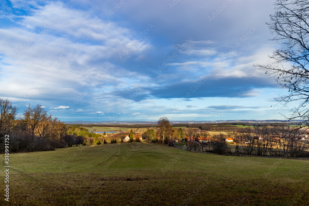 Landscape of South Bohemia with villages, forests, fields and blue sky. Czech Republic.