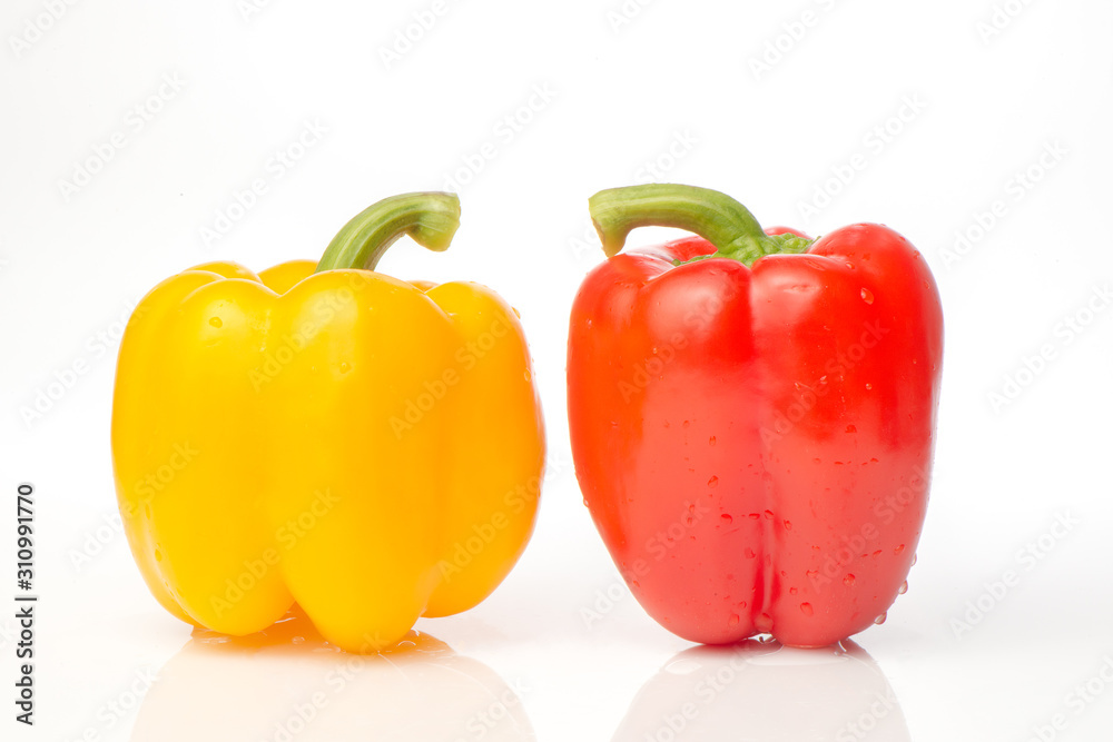 Two red and yellow Fresh pepper are isolated in white background. Two red and yellow Fresh pepper are isolated in white background.