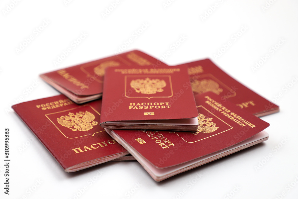 Russian passport, five pieces, on a white background. Russian passport, five pieces, on a white background.