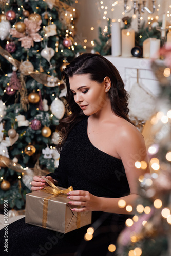 young woman with christmas presents
