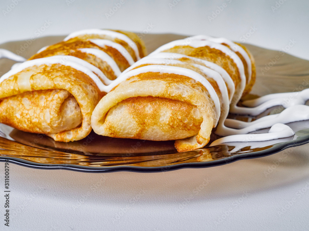 pancakes with sour cream on a plate pancakes with sour cream on a plate