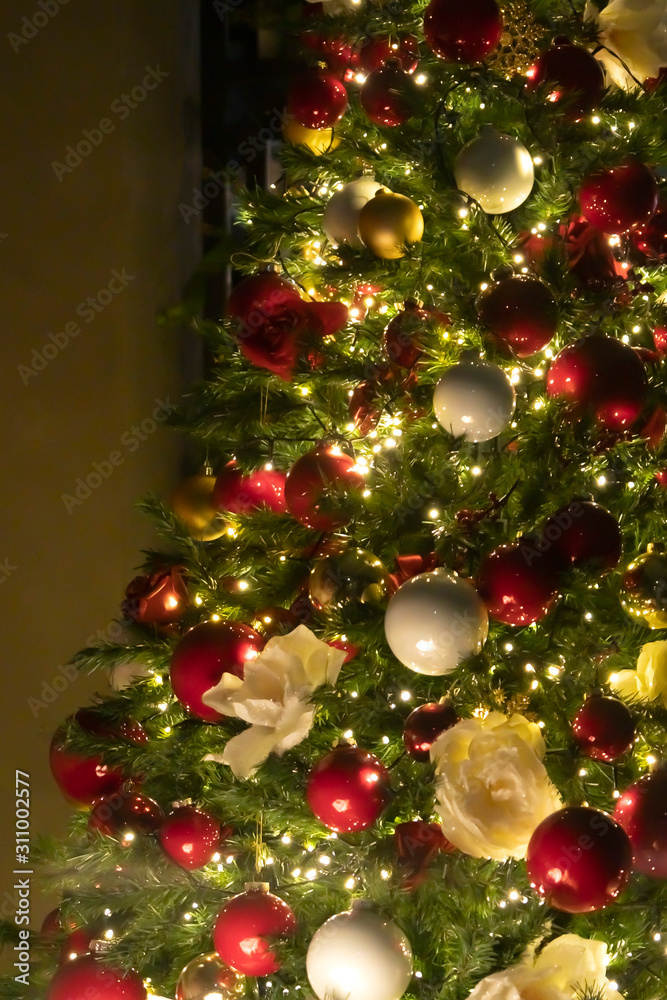 Christmas tree background - baubles and branch of spruce tree