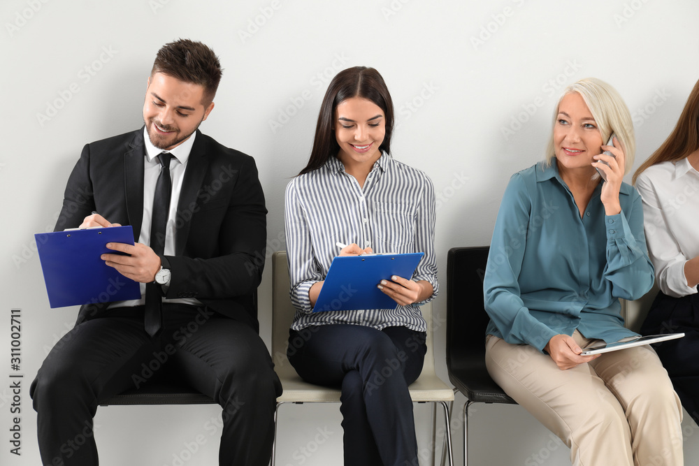 People waiting for job interview in office People waiting for job interview in office