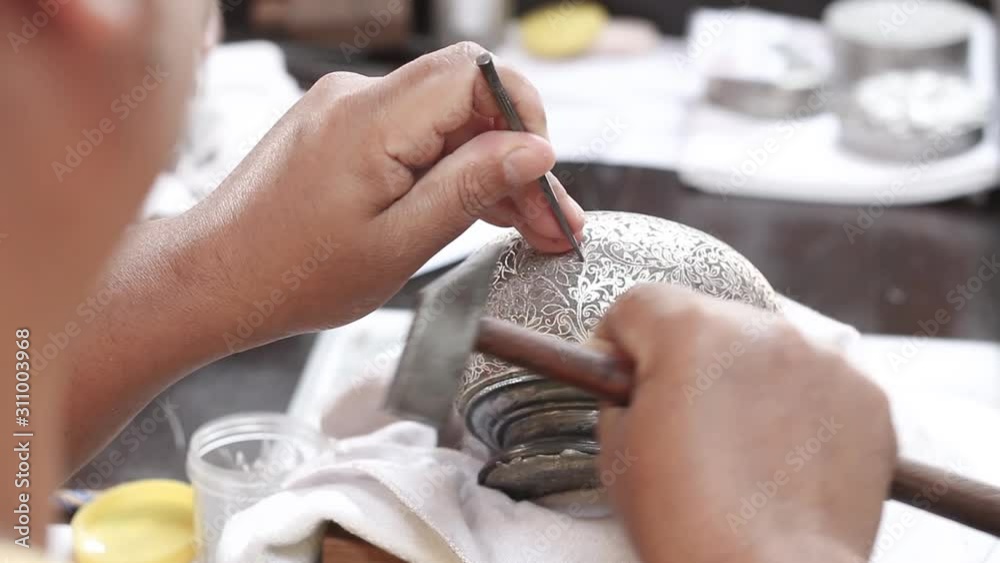 Ktram is the technique of inlaying fine silver or gold threads, beating them into designs on an iron surface. 
