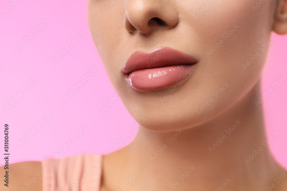 Woman with glossy lipstick on pink background, closeup Woman with glossy lipstick on pink background, closeup