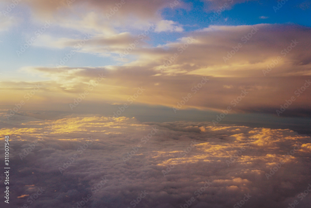 clouds at sunset from iljuminatora plane sky Sun travel