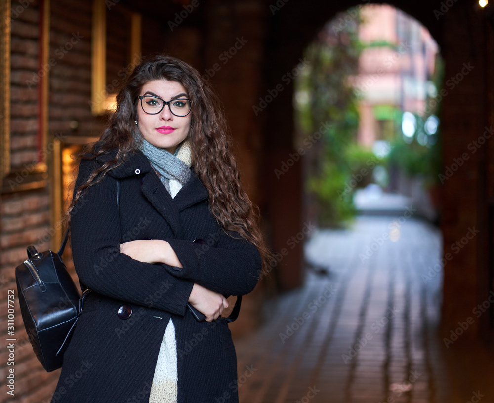 Fototapeta premium Young woman in an old town