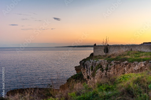 sunset on coast of sea