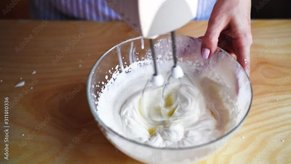 girl whips cream for tiramisu cake, slow motion girl whips cream for tiramisu cake, slow motion