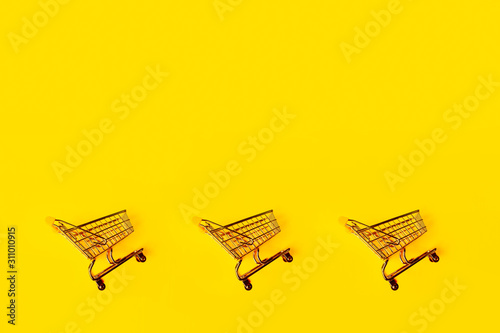 Three shopping carts  pattern. concept of shopping and sales  retail and shops.