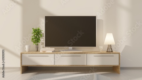 TV on a low table in the interior of the room with a white brick wall. 3D rendering. 3D illustration.
