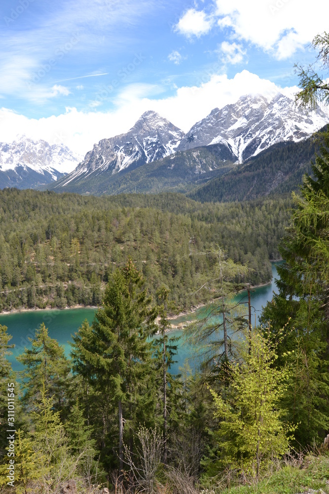 Alpine lake in the spring sun