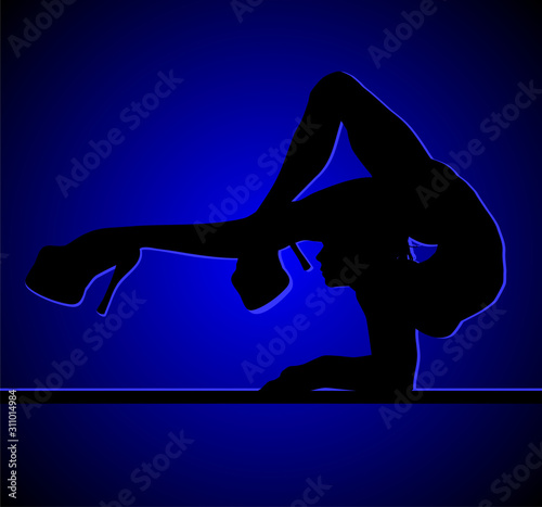 Flexible dancing girl in blue light.