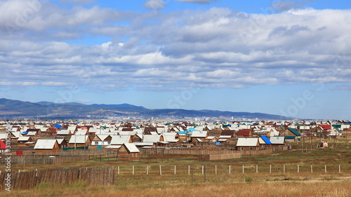 Small wooden huts at the suburbs of Siberian city Ulan-Ude, Buryatia, Russia. photo