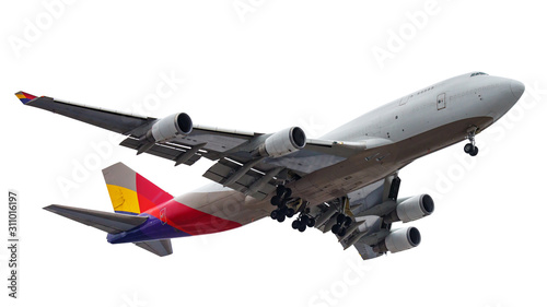 Flying big modern passenger aircraft with landing gear isolated on a white background