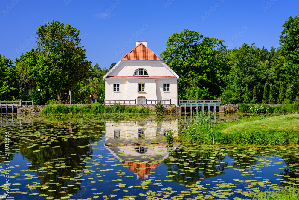 Sightseeing of Estonia. Vihula manor (Vihula möis) museum in Lahemaa National Park. Beautiful summer landscape. A picturesque Park with a pond. Sightseeing of Estonia. Vihula manor (Vihula möis) museum in Lahemaa National Park. Beautiful summer landscape. A picturesque Park with a pond.