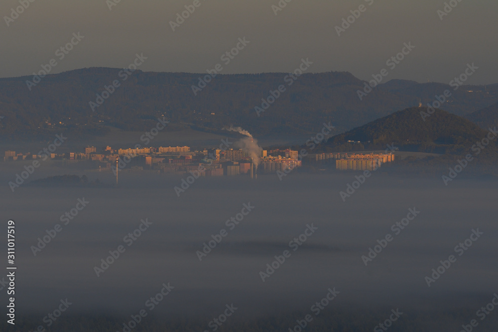 View of city in morning mist. Industrial fog on cityscape